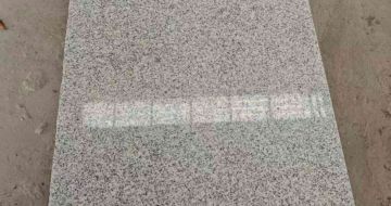 丹东芝麻白光面毛板